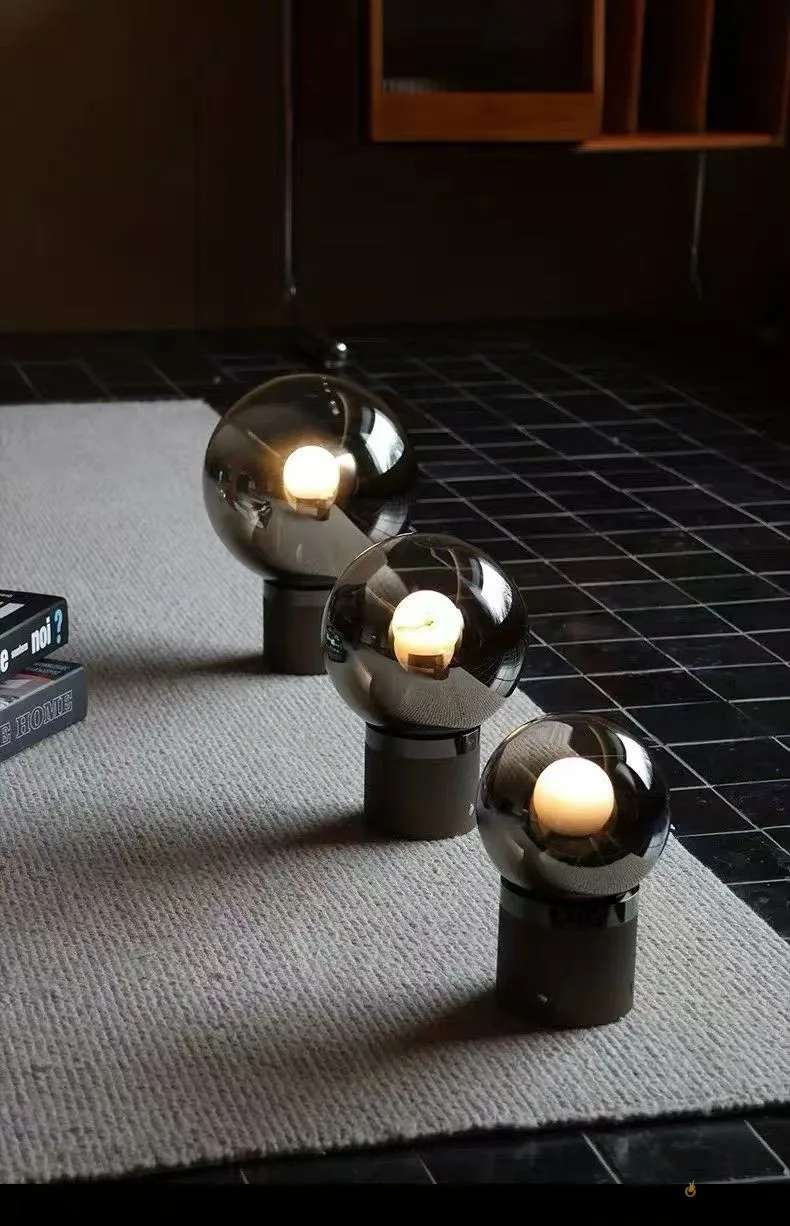 Eclipse smoked glass table lamp with round tinted glass shade and metal base